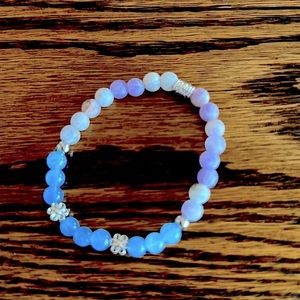 Handcrafted gemstone bracelet with amethyst and aquamarine.